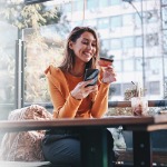 Woman with card and phone