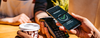 Contactless payment option as person pays with their phone