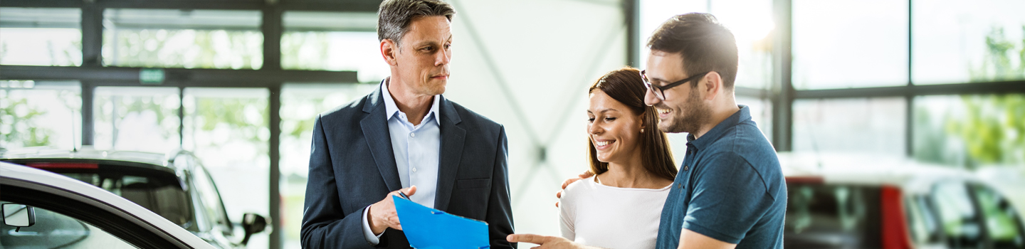 Couple reviewing auto purchase