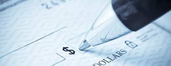 close up image of pen and check