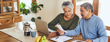 couple at computer working on financials