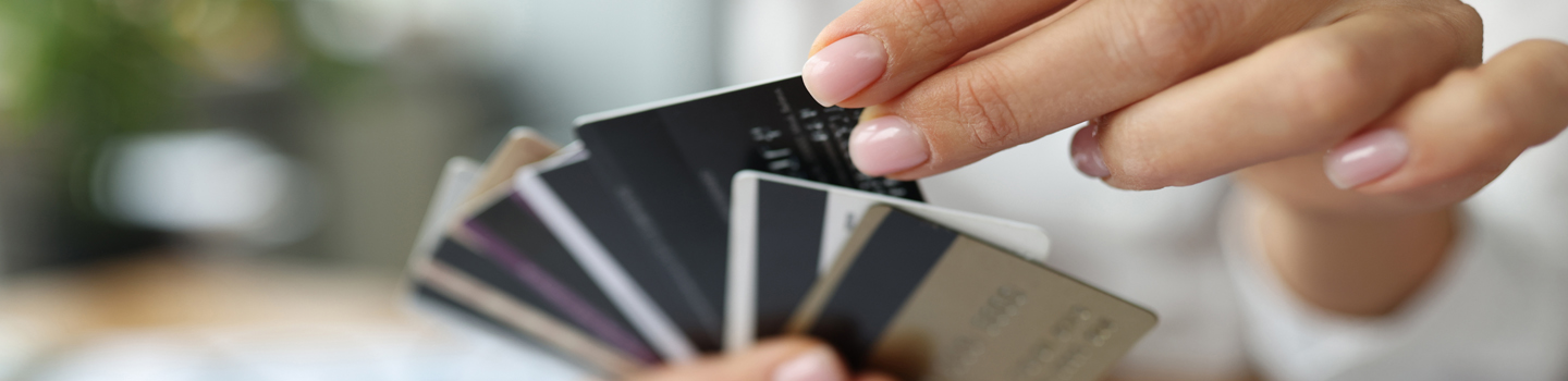 Woman chooses from many credit cards