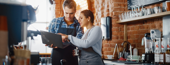 Business employees with laptop talking