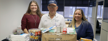 Military support donation drive wrap up photo of people accepting donations