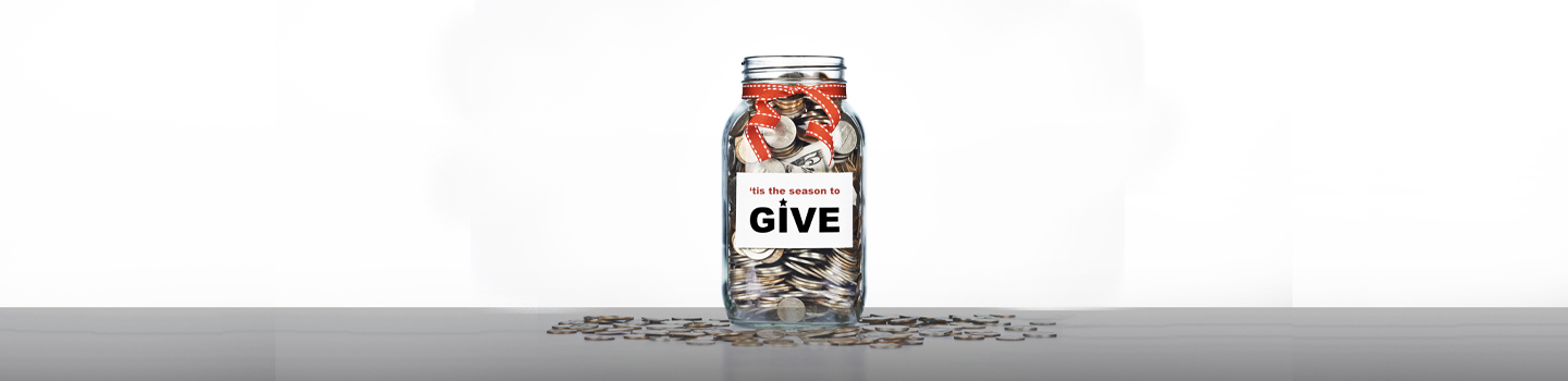 image of jar with coins and sign that says give