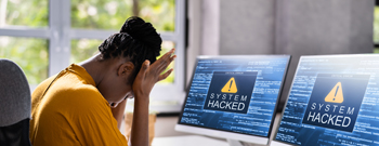 woman upset because computer shows system hacked